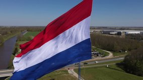 Real large Dutch Flag waving gently in de wind. The Dutch flag is a national symbol of the Netherlands. Dutch red white blue flag. Used for National events and patriotism or an ensign of the country. - Powered by Shutterstock - Get 15% off with code: PIKWIZARD15