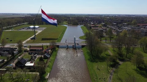 Real large Dutch Flag waving gently in de wind. The Dutch flag is a national symbol of the Netherlands. Dutch red white blue flag. Used for National events and patriotism or an ensign of the country.