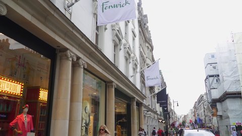 LONDON, UK- JULY 25, 2019. People walking in front of Fenwick department store shop on New Bond Street in London