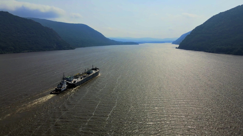 Aerial drone video footage of a large cargo ship on the Hudson River in New York