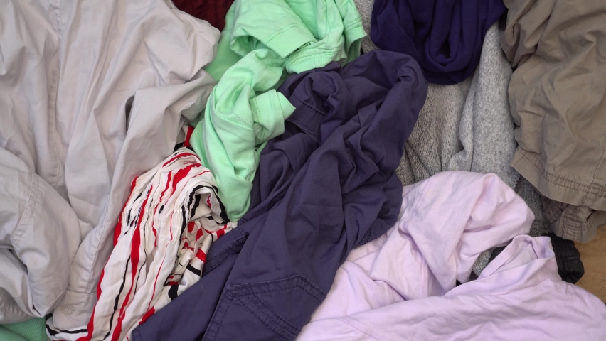 Pile of old used clothes. Disposal, recycling concept, donation, charity, second hand. Waste recycle Royalty-Free Stock Footage #1079451560