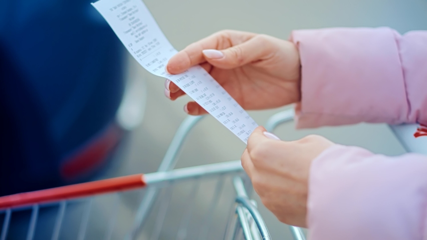 Buyer Checks Paper Receipt On Shopping Supermarket. Customer Receipt Bill Expensive Total.Budget Cash Register Money Spending On Hypermarket.Home Finance Budget. Check Bill Grocery Store Shopping Cart Royalty-Free Stock Footage #1079452820