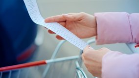 Buyer Checks Paper Receipt On Shopping Supermarket. Customer Receipt Bill Expensive Total.Budget Cash Register Money Spending On Hypermarket.Home Finance Budget. Check Bill Grocery Store Shopping Cart - Powered by Shutterstock - Get 15% off with code: PIKWIZARD15