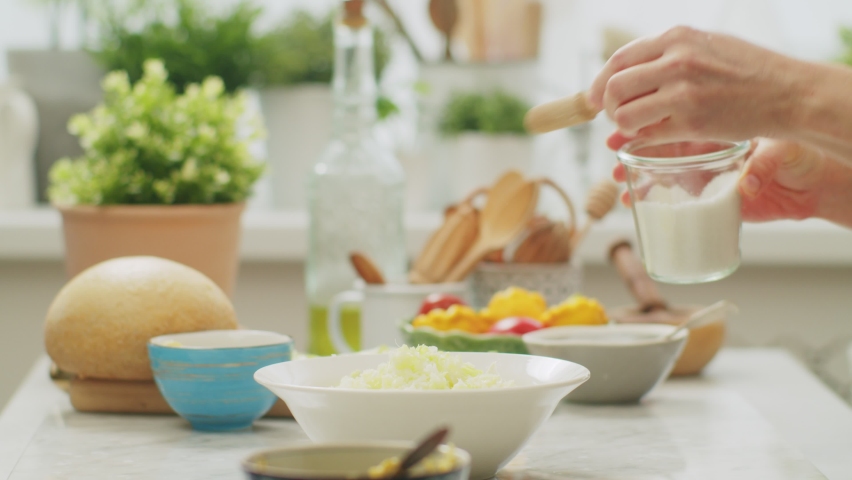 Chef cook salting cabbage salad