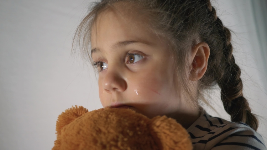 Girl is cry in corner. Violence against children in family. Family violence. Cry kid. Family violence concept. Girl is cry with fear. Child abuse. Sad family. Fear of child in dark. Kid cry in corner Royalty-Free Stock Footage #1079468414