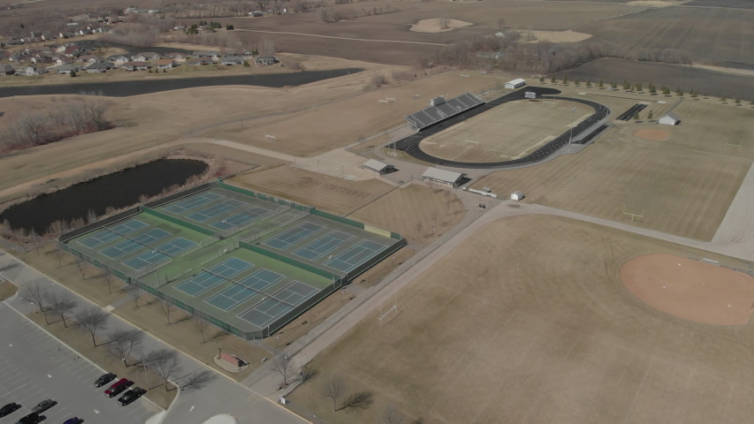 Drone shot of empty tennis and track and field