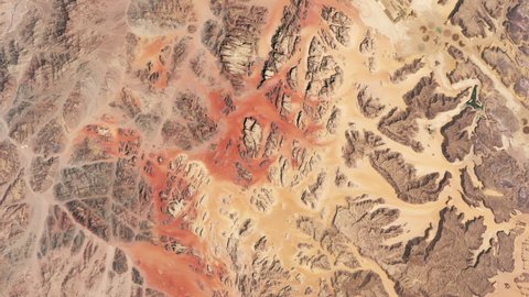 Wadi Rum desert aerial satellite view sunrise animation. Scenic travel destination part of Unesco world heritage. Contains image furnished by Nasa