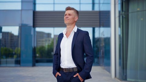 Business. Businessman Standing City Street Office Building. Handsome Caucasian Male Business Person Portrait Corporative Building Background Successful Young Adult Manager Hands crossed On Chest 