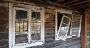 Old wooden abandoned house with broken windows. Cinema 4K 60fps video