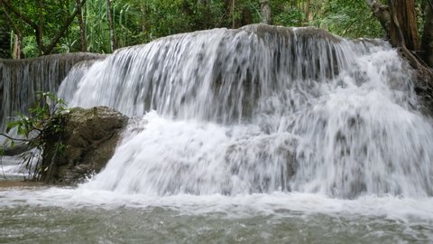Close up of waterfall flowing rapids in tropical rainforest at national park