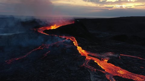 Lava flows from Mount Fagradalsfjall, aerial evening view, iceland
4K drone shot of lava spill out of the crater  Mount Fagradalsfjall, September 2021, Iceland 

