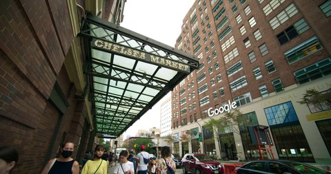 New York, New York  United States - September 2,  2021: The entrance of Chelsea Market and the Entrance of Google Headquarters on 111 8th ave manhattan. Wide angle pan.