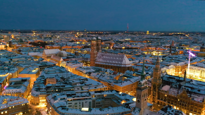 Munich aerial skyline view at night with snow winter time christmas, fly over marienplatz sqaure
frauenkirche church and town hall, munich night drone video birds view. | Shutterstock HD Video #1079497565