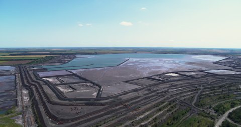 Tailing Dump and Lake in Industrial City Aerial Panorama View