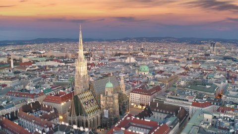 Aerial: Moving Toward and Circle St. Stephen's Cathedral in Vienna, Austria, Vienna skyline at sunrise old town vienna cathedral