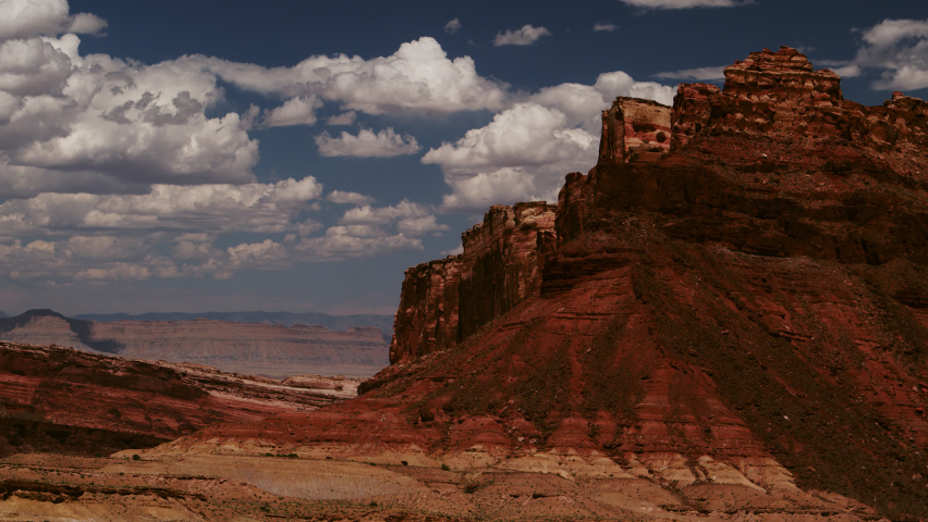 Whimsical cumulus clouds float above Black Dragon Canyon at San Rafael Swell, Utah on an idyllic summer day. *Robbers Roost at the San Rafael Swell, Utah