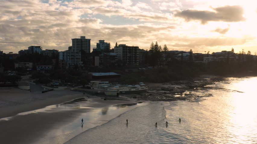 Aerial Drone Shot of Beautiful Beach with Bright Beautiful Sunset Behind Coastline