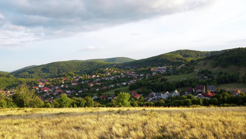 Timelapse video from Hungary, Bükkszentkereszt lookout tower with the spectacular view with field, traditional village and mountains in the background.