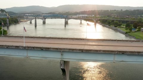 American flags on Veterans Memorial Bridge in Chattanooga. Tennessee River at sunset.