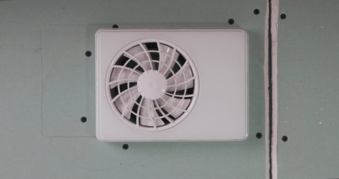 Switching on an air ventilator for humidity control in room. Fresh air.