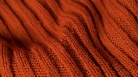 Orange Brown Knitted Warm Texture Of Fabric Sweater Plaid Bedspread Clothes, Macro. Knitted Material, Textiles.