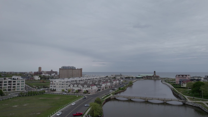 Drone flying over hotels towards Jersey shoreline