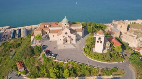 4k drone flight moving to the side footage (Ultra High Definition) of Cattedrale di San Ciriaco church and San Gregorio Illuminatore - Catholic church. Summer cityscape of Ancona town, Italy, Europe.