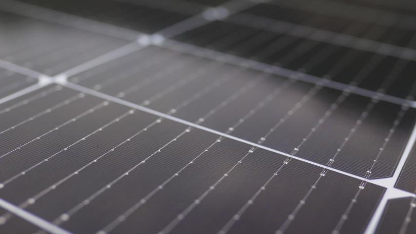 View from the camera moving next to the solar panels. Close-up of modern photovoltaic solar battery panels. Solar panel, photovoltaic, alternative electricity source. Efficient ecological solar farm. Royalty-Free Stock Footage #1079539520