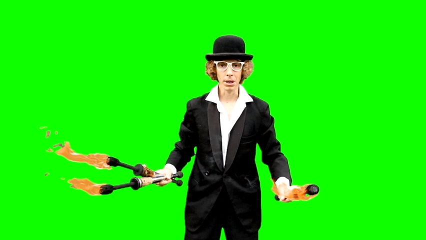 Man juggling balls and pins. Juggler man throwing balls. A professional Funny magician artist performs a juggling show. Clown performance magic and funny acrobatic. Street performer juggles. Royalty-Free Stock Footage #1079544530