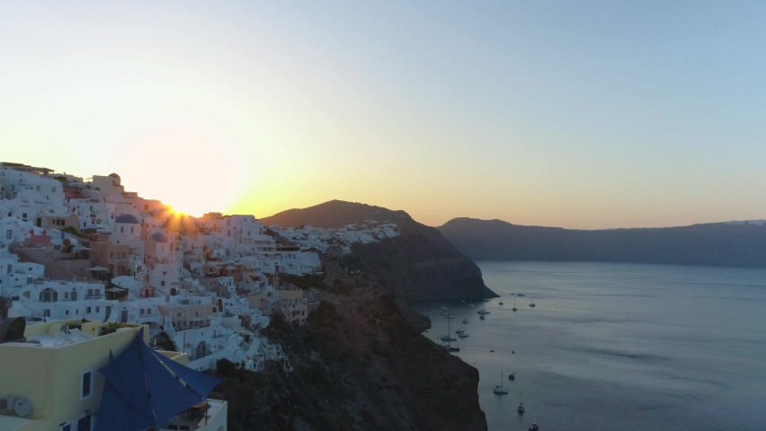 Fantastic sunrise on the legendary island of Santorini, Greece. Aerial video on a drone in the town of Oia, beautiful little white houses with blue roofs | Shutterstock HD Video #1079545085