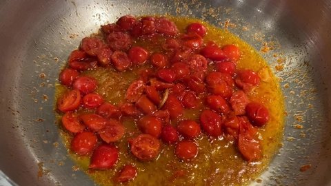Cooking  Italian tomatoes will clams  in Italy