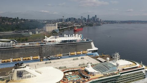 Seattle , WA , United States - 06 19 2021: Cinematic 4K aerial drone footage of the deck of a cruise ships waiting for departure to Alaska at the Smith Cove Pier 90 cruise terminal in Seattle 
