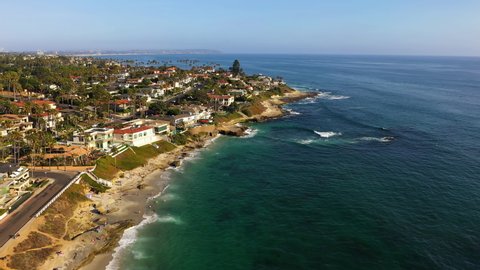 Affluent coastal homes in La Jolla, California. Aerial flying forward