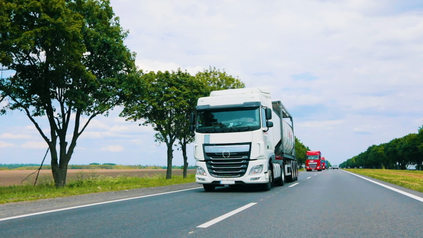 A large modern truck drives along the highway, scanning the road with security systems. Concept of a futuristic self-driving truck. Security system in cars Royalty-Free Stock Footage #1079550209