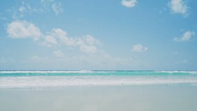 Beach pastel color sky. Landscape view Sea and sand summer beach space area background.Blue sea waves and sky on sand famous beach.Scenic view beach after Covid-19.Close-up.High quality 4k footage