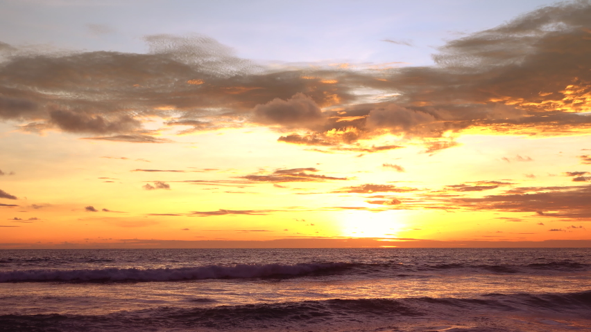 4K Beautiful landscape view of sunset  sand beach on holiday summer background.Tropical island destination travel relaxing on famous beach.Close up.