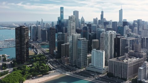 Aerial shot of roof tops of the prestige residential apartments at the bay. 4K beautiful cityscape, Chicago, Illinois, United States of America. Modern city at the Michigan lake coast on sunny day