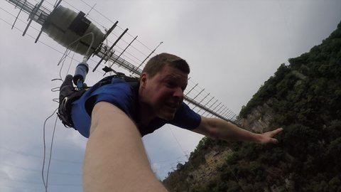 Sochi, Russia-10.05.2020: Man jumping off a bridge with a bungy in Sochi Skypark