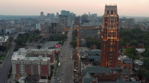 Nashville , TN , United States - 08 10 2021: Beautiful Vanderbilt University at dawn. Nashville skyline cityscape in distance. 