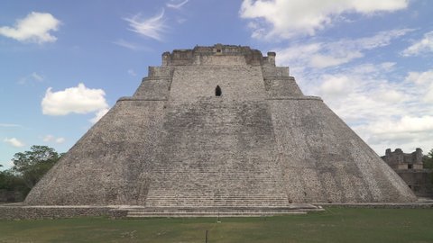 UXMAL, YUCATAN, MEXICO - MAY 2021: The Pyramid of the Magician, the most recognizable landmark of ancient Mayan city of Uxmal