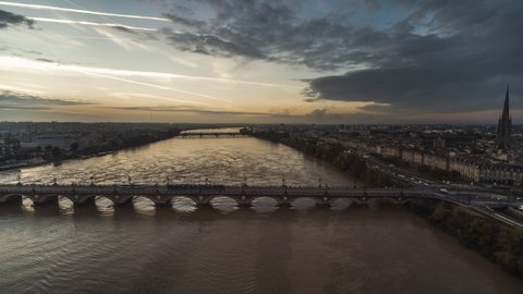 Establishing Aerial View Shot of Bordeaux Fr, light fog, Pont de Pierre, world capital of wine, Nouvelle-Aquitaine, France, track to the side