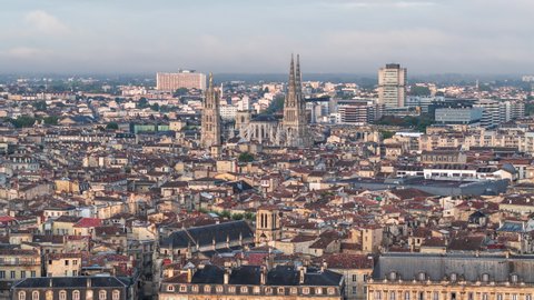 Establishing Aerial View Shot of Bordeaux Fr, world capital of wine, Nouvelle-Aquitaine, France, 
Bordeaux Cathedral in holy light