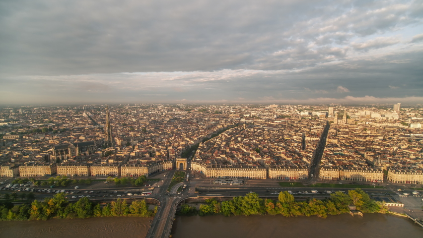 Establishing Aerial View Shot of Bordeaux Fr, world capital of wine, Nouvelle-Aquitaine, France, epic wide, warm light