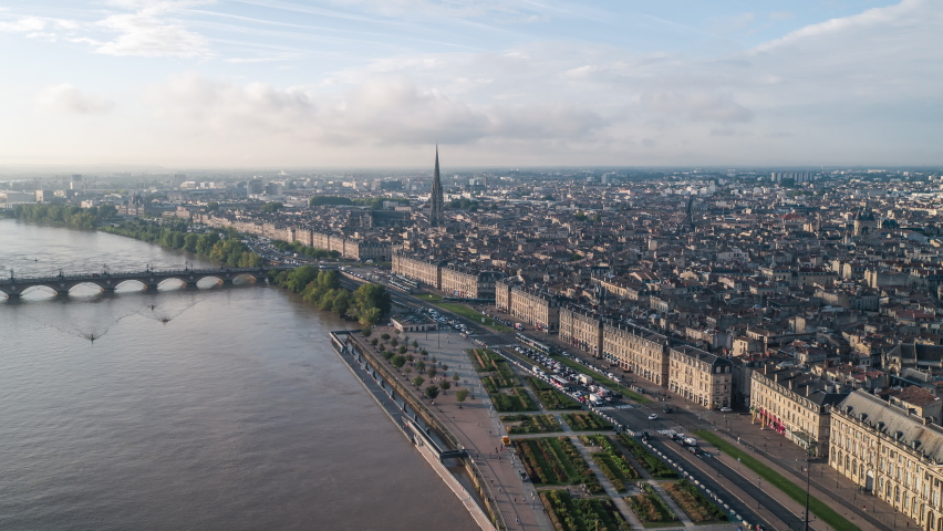 Establishing Aerial View Shot of Bordeaux Fr, world capital of wine, Nouvelle-Aquitaine, France, city waterfront, day