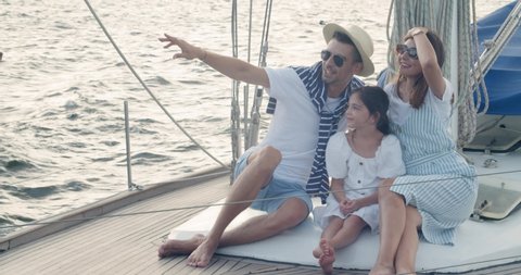 Happy family spending time on yacht