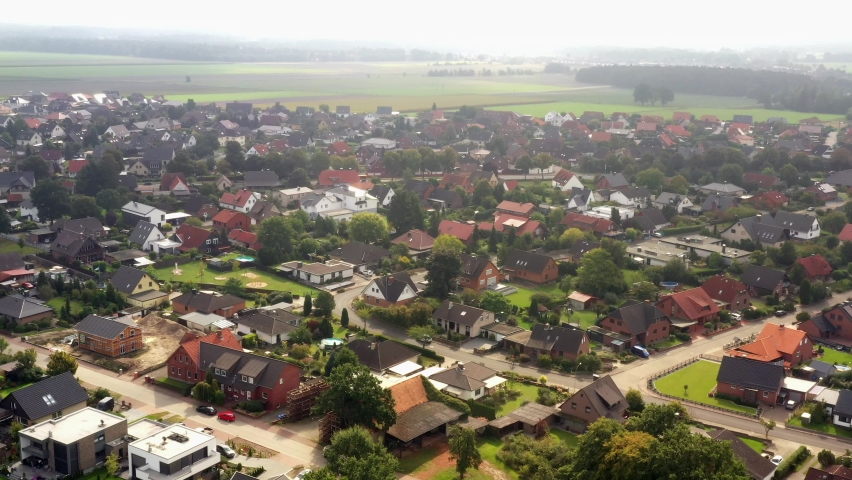 Aerial view of development with single-family houses at the edge of village in a new development area in Germany Royalty-Free Stock Footage #1079578886