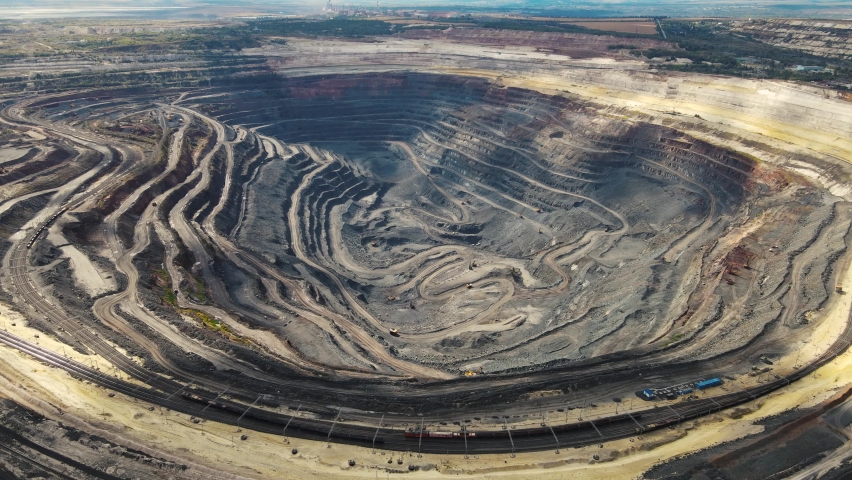 drone moves along a mining pit Royalty-Free Stock Footage #1079584694