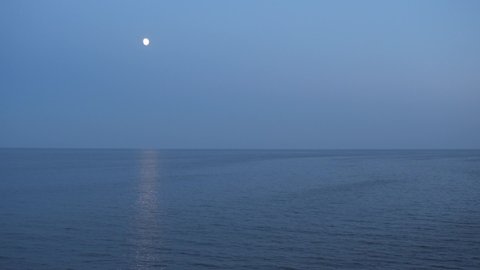 Moon path over the sea. Beautiful shiny moon path on the surface of the sea.