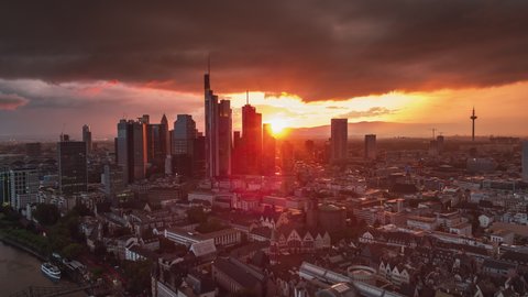 Into the sun, Stormy sunset, Establishing Aerial View Shot of Frankfurt am Main De, financial capital of Europe, Hesse, Germany