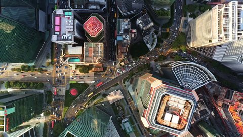 Skyscraper tower building, car traffic transportation in financial business district at Singapore city, drone aerial cityscape top view. City life, public transport, commuter lifestyle concept